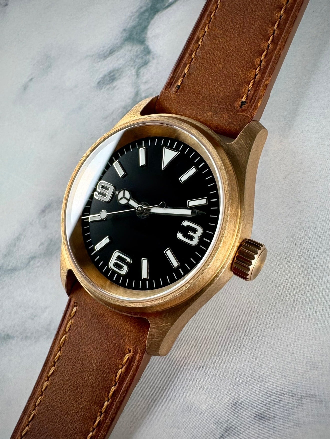 Bronze automatic field watch with Explorer dial and Seiko NH35 movement.