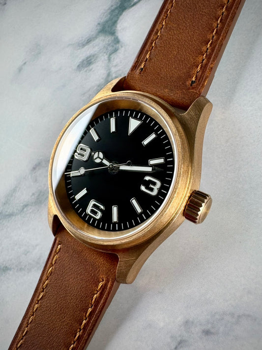 Bronze automatic field watch with Explorer dial and Seiko NH35 movement. 